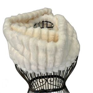 Faux fur infinity neck scarf in cream for winter warmth.